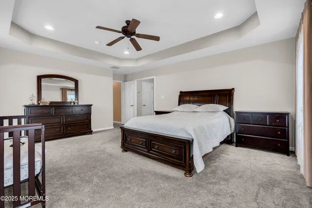 a bedroom with a bed and a desk