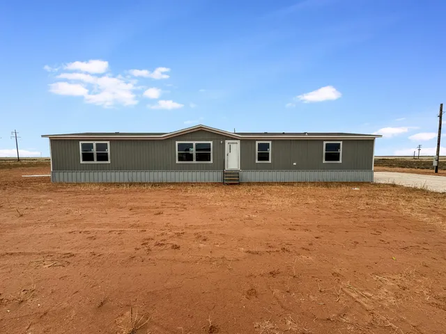 a view of pool with yard