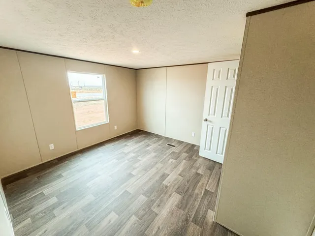 a bathroom with a granite countertop sink a toilet and a shower