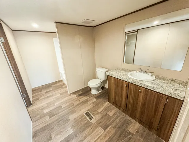 a bathroom with a bathtub and a toilet