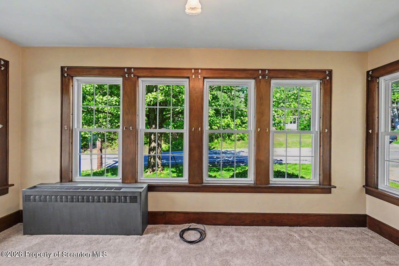 502 Layton Road Clarks Summit, PA 18411 - Photo 12 of 42 a living room filled with furniture and a window