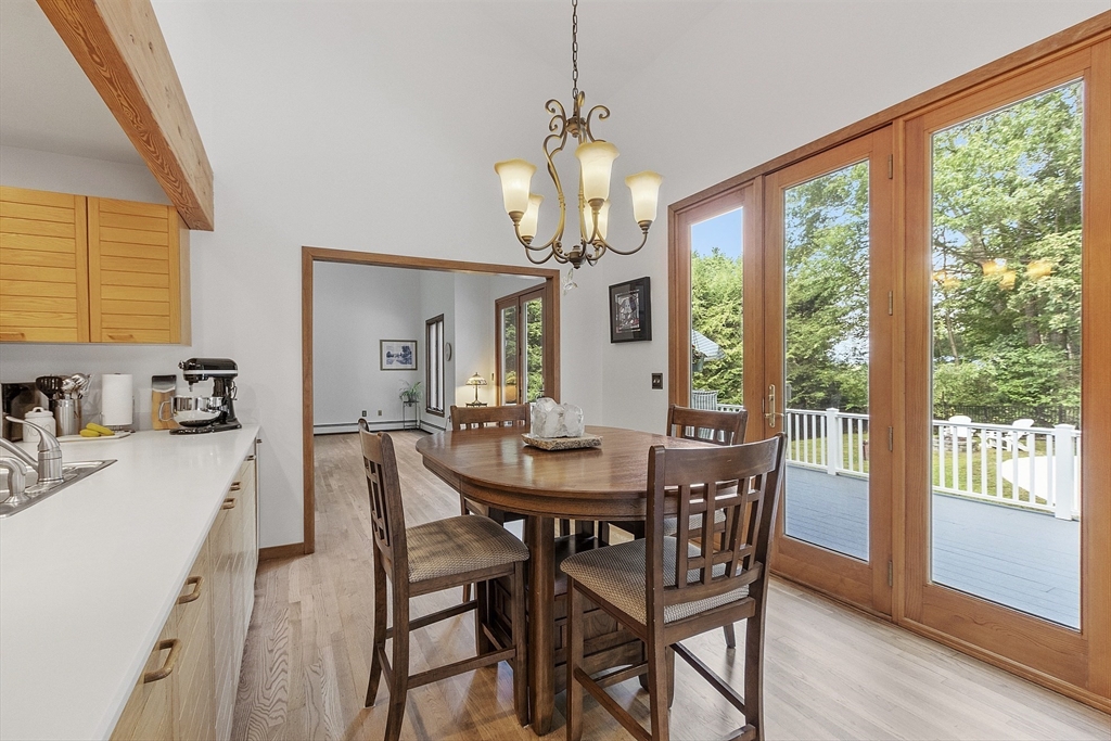 22 Kettle Hole Road Bolton, MA 01740 - Photo 13 of 42 a view of a dining room with furniture window and wooden floor