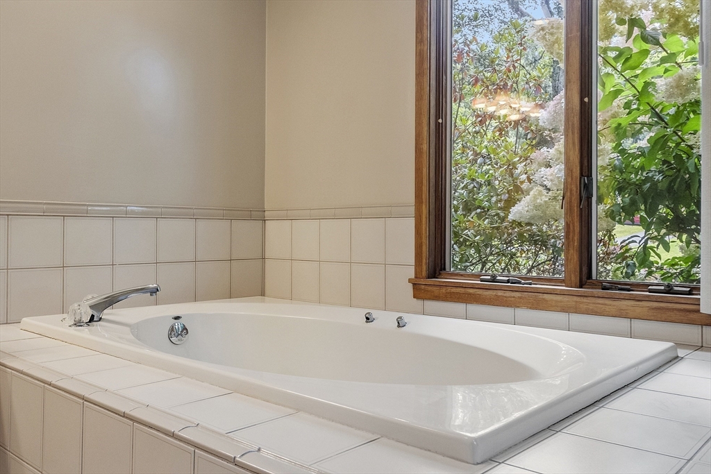 22 Kettle Hole Road Bolton, MA 01740 - Photo 23 of 42 a white bath tub sitting in front of a window