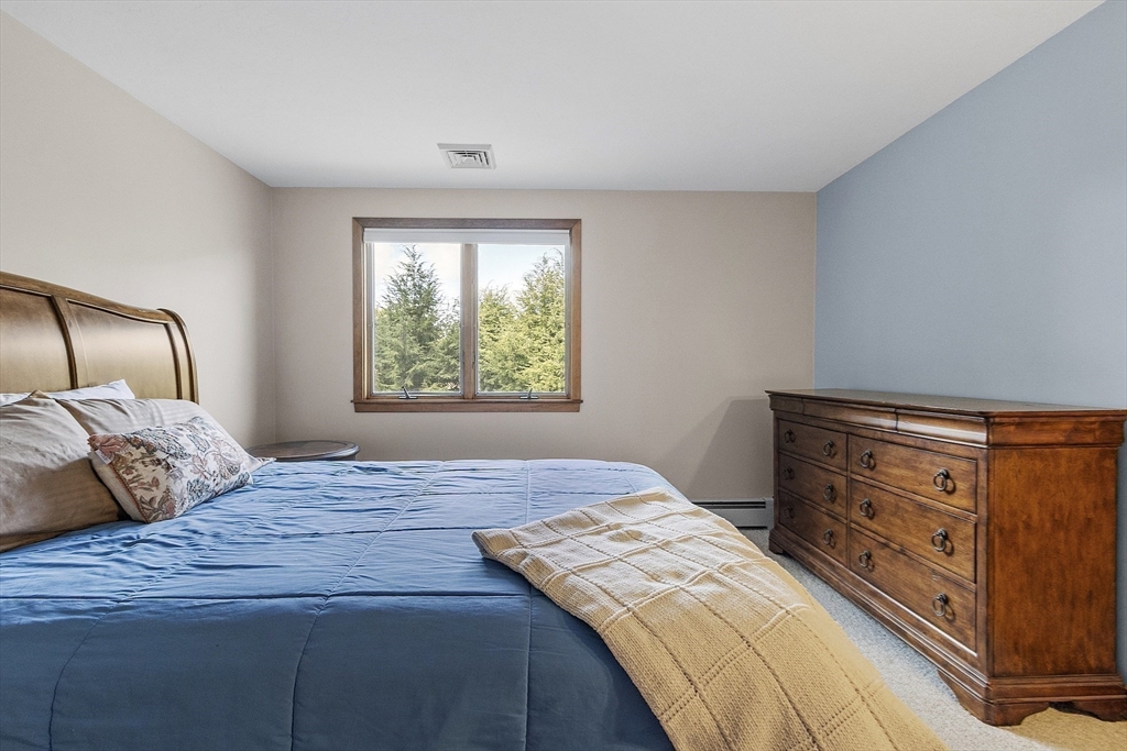 22 Kettle Hole Road Bolton, MA 01740 - Photo 29 of 42 a bedroom with a bed and window