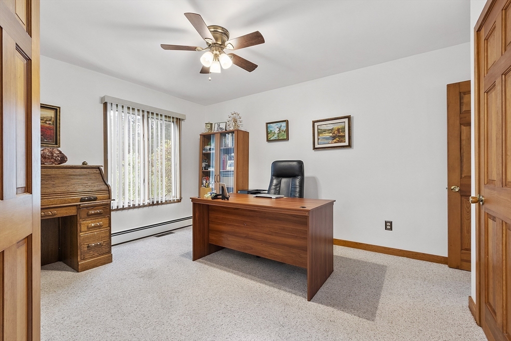 22 Kettle Hole Road Bolton, MA 01740 - Photo 6 of 42 a living room with furniture and a flat screen tv