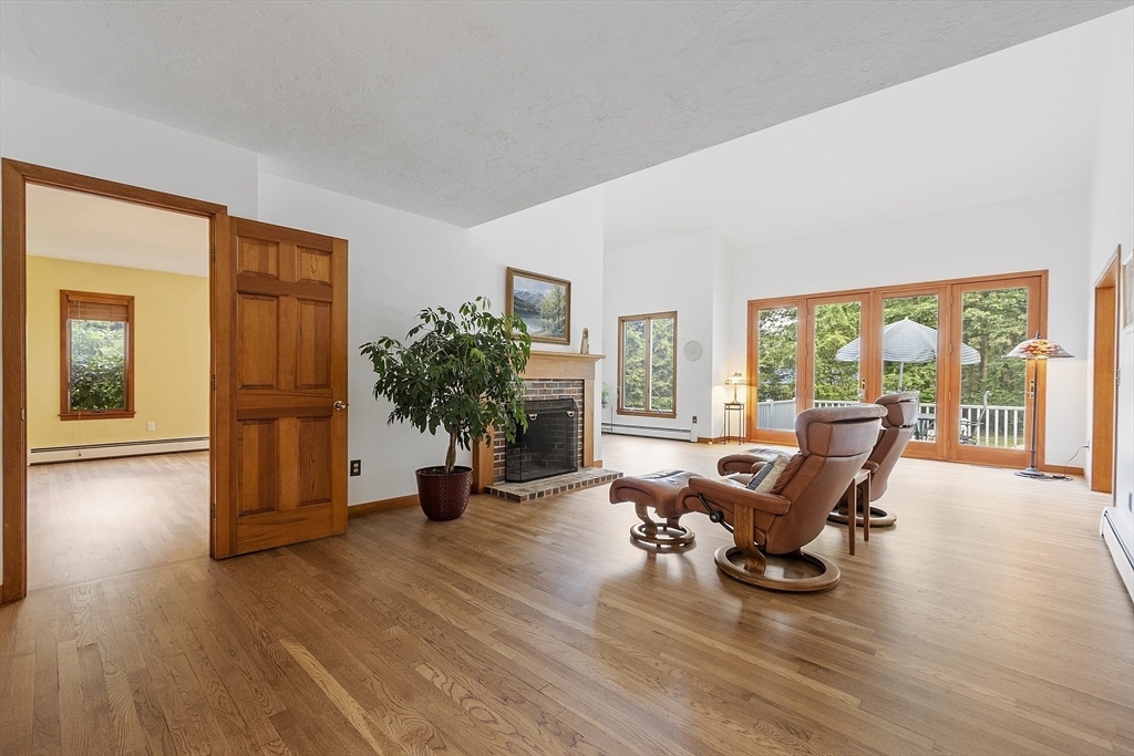 22 Kettle Hole Road Bolton, MA 01740 - Photo 8 of 42 a living room with furniture and wooden floor