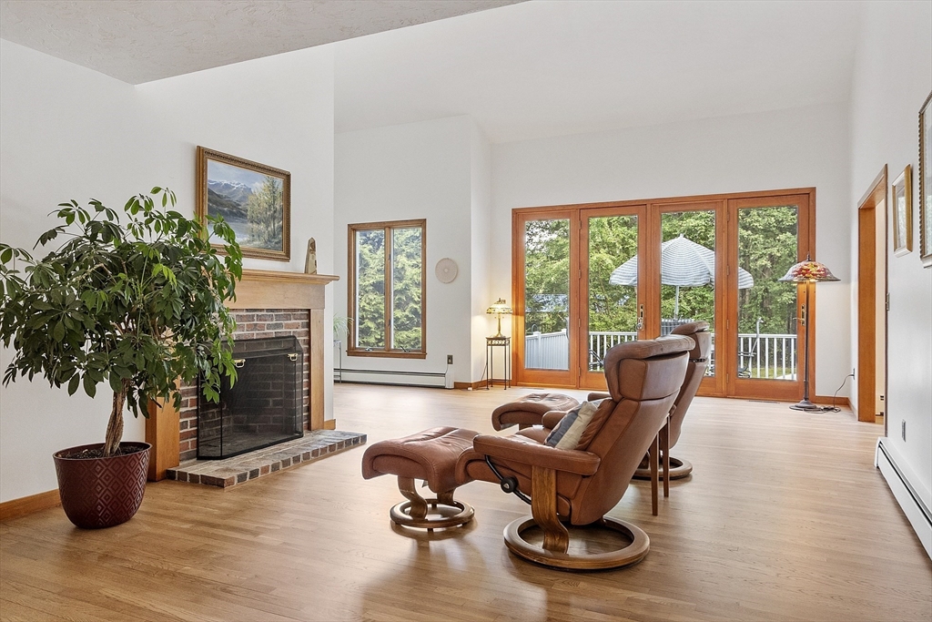 22 Kettle Hole Road Bolton, MA 01740 - Photo 9 of 42 a living room with furniture and floor to ceiling windows