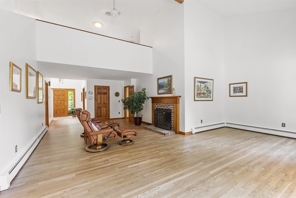 22 Kettle Hole Road Bolton, MA 01740 - Photo 10 of 42 a view of a livingroom with furniture and a fireplace