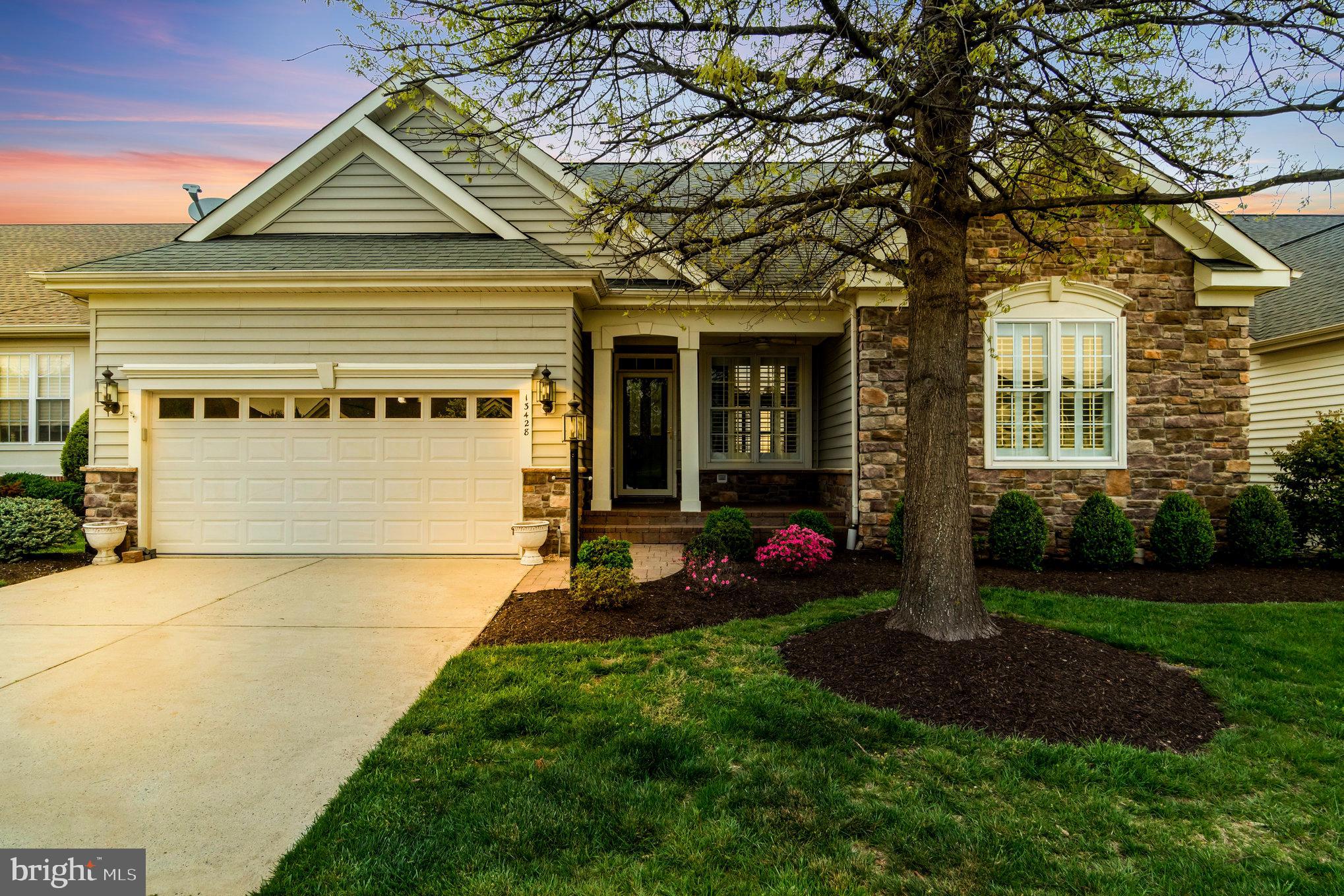 13428 Fieldstone Way Gainesville, VA 20155 - Photo 1 of 46 a front view of a house with a yard and garage