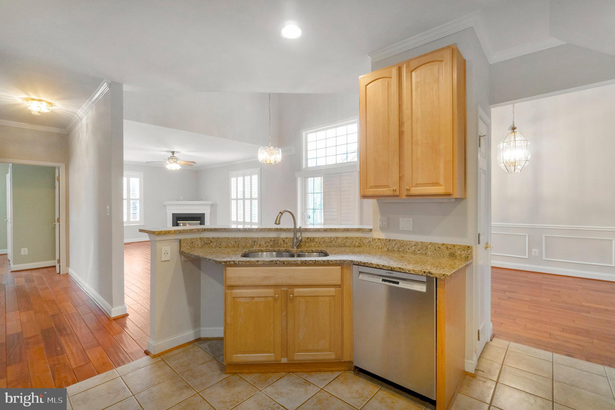 13428 Fieldstone Way Gainesville, VA 20155 - Photo 17 of 46 a kitchen with stainless steel appliances granite countertop a sink and a cabinets