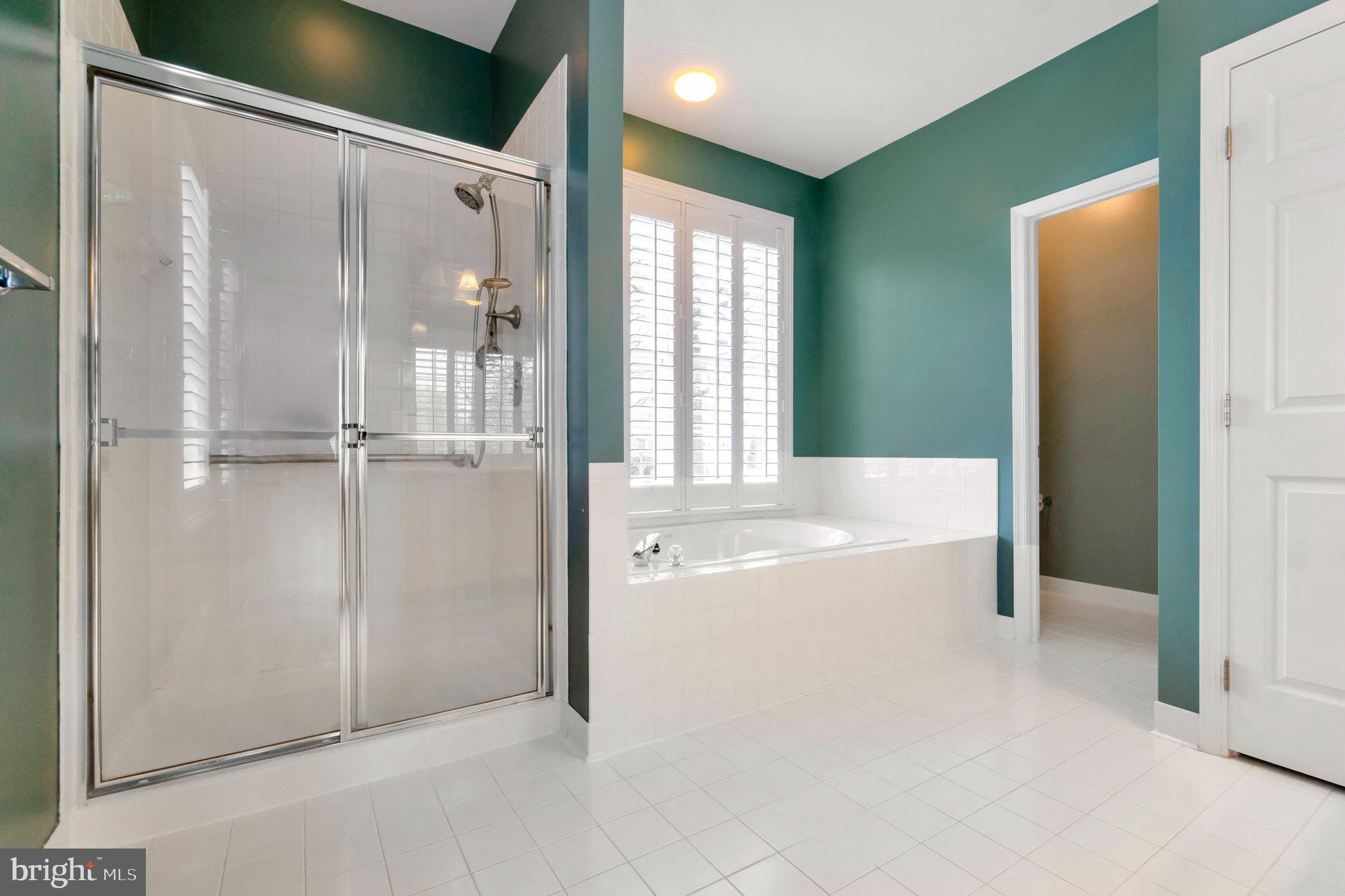 13428 Fieldstone Way Gainesville, VA 20155 - Photo 22 of 46 a spacious bathroom with a tub and shower