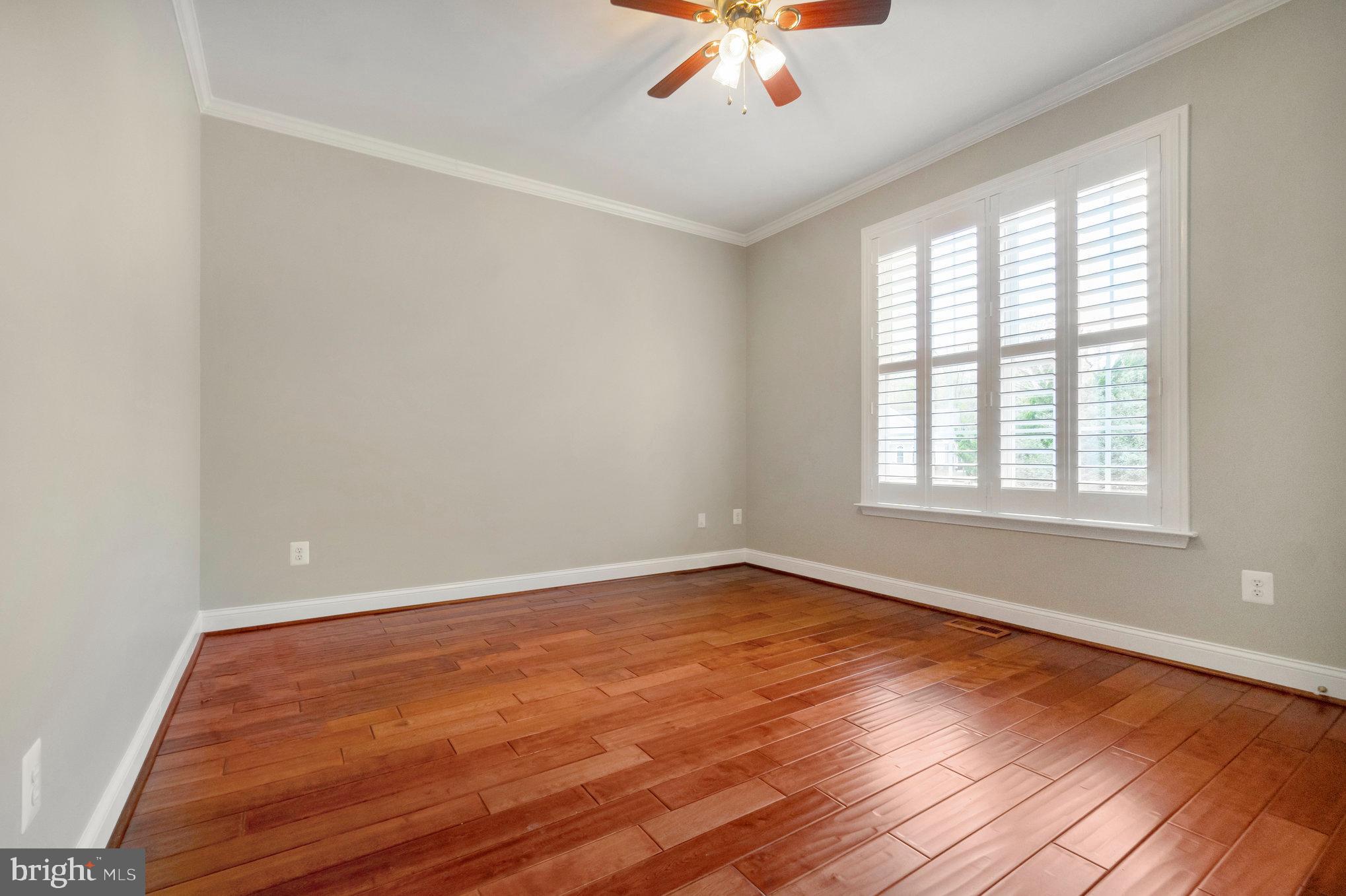 13428 Fieldstone Way Gainesville, VA 20155 - Photo 28 of 46 wooden floor in an empty room with a window