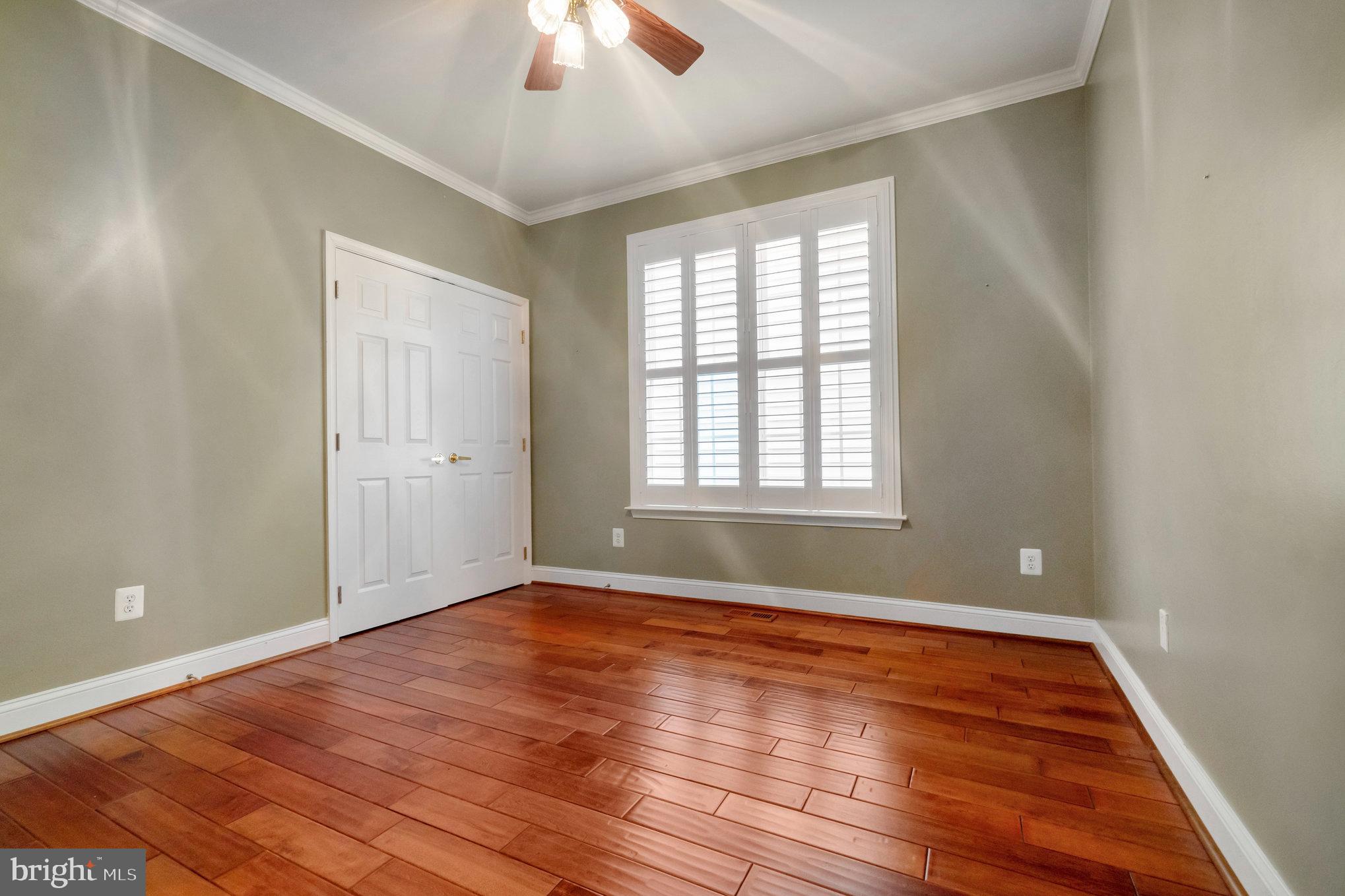 13428 Fieldstone Way Gainesville, VA 20155 - Photo 29 of 46 wooden floor in an empty room with a window