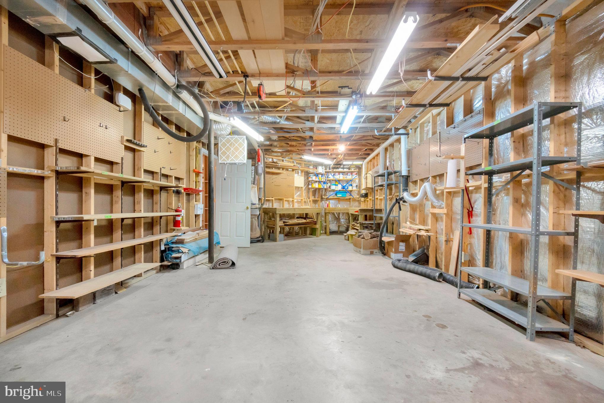 13428 Fieldstone Way Gainesville, VA 20155 - Photo 35 of 46 a view of an empty room with wooden shelves