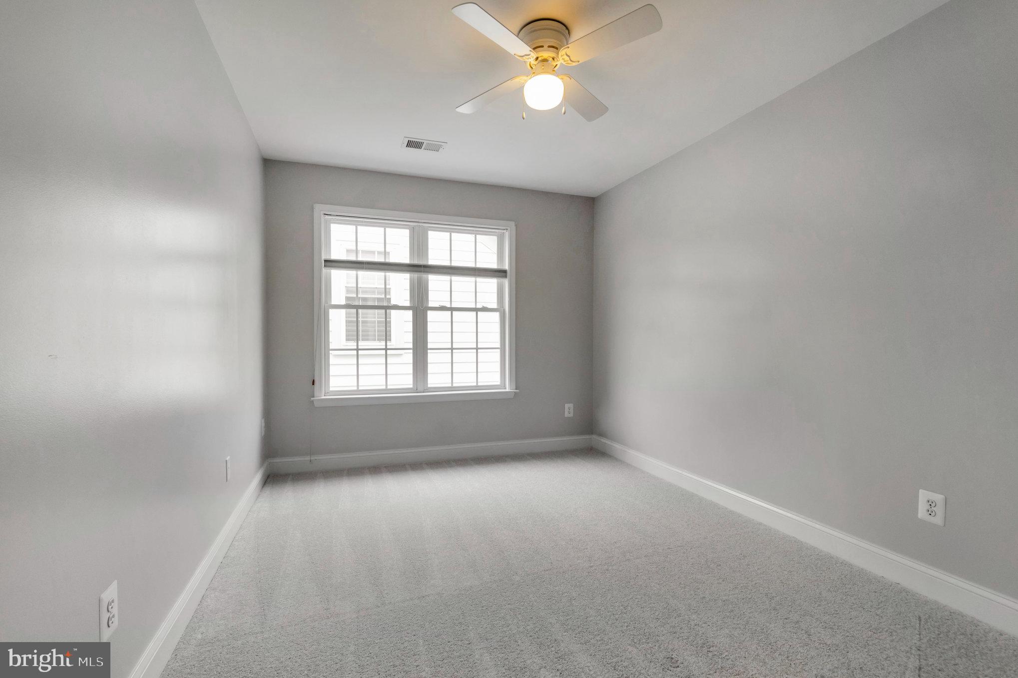 13428 Fieldstone Way Gainesville, VA 20155 - Photo 36 of 46 an empty room with a window and a fan