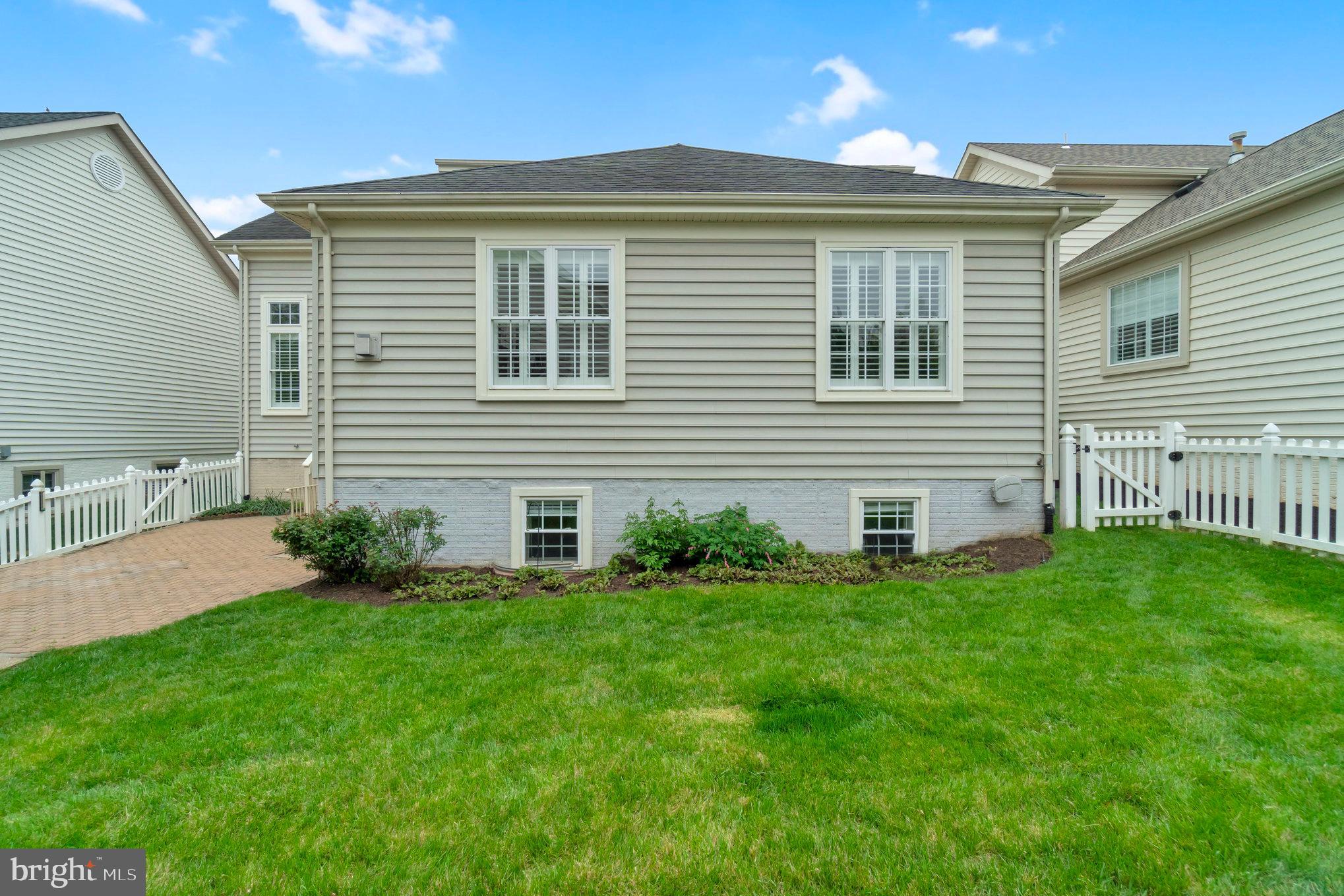 13428 Fieldstone Way Gainesville, VA 20155 - Photo 7 of 46 a front view of a house with a yard
