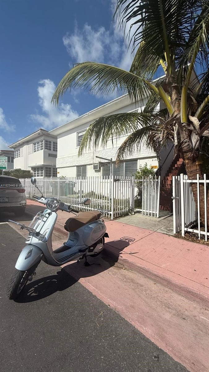 8132 Harding Avenue, Unit 2 Miami Beach, FL 33141 - Photo 1 of 20 a view of a patio with a table and chairs
