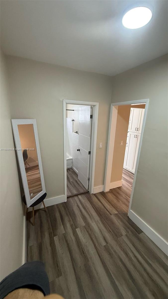 8132 Harding Avenue, Unit 2 Miami Beach, FL 33141 - Photo 11 of 20 a view of an empty room and wooden floor