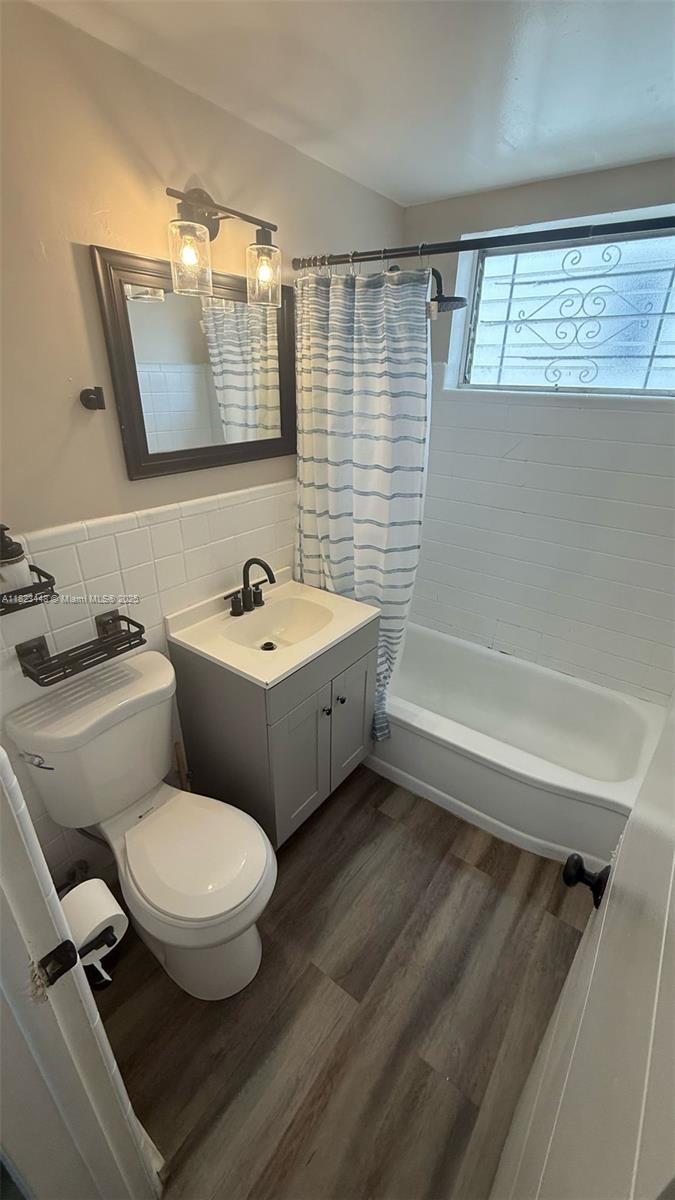 8132 Harding Avenue, Unit 2 Miami Beach, FL 33141 - Photo 12 of 20 a bathroom with a toilet a sink and bathtub