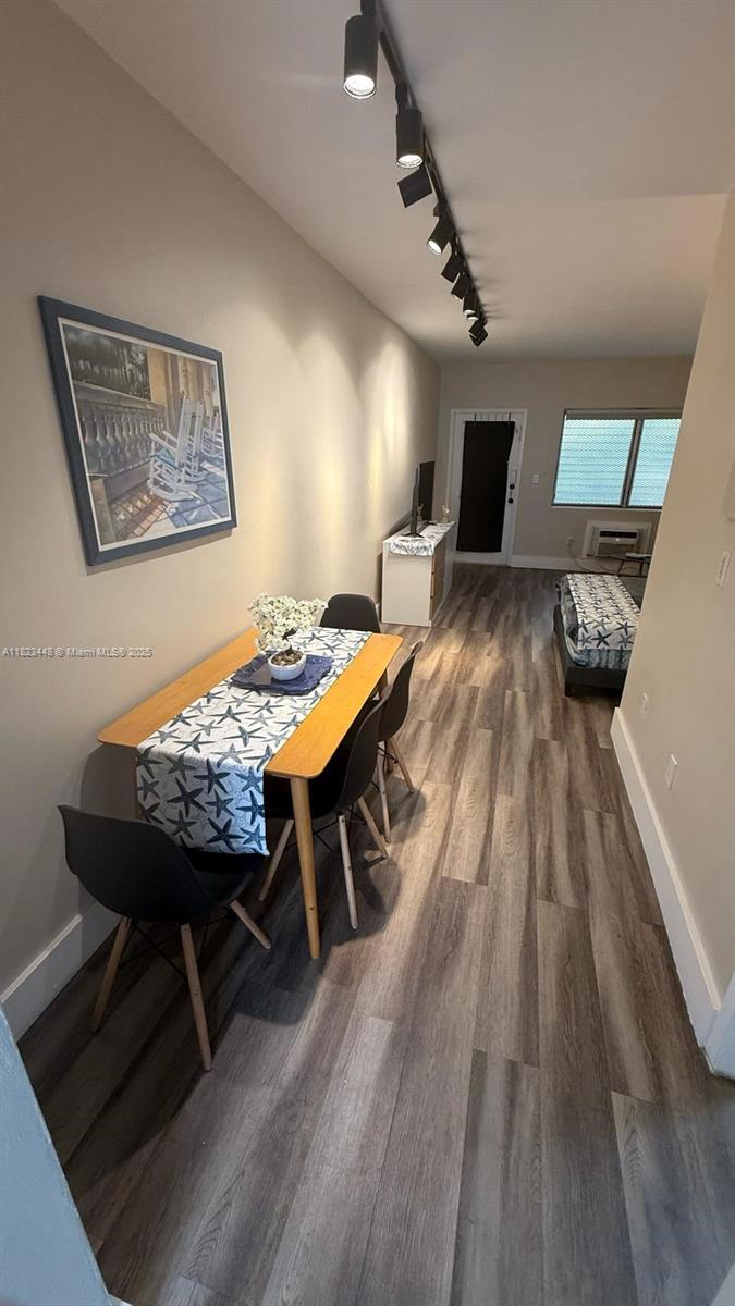 8132 Harding Avenue, Unit 2 Miami Beach, FL 33141 - Photo 4 of 20 a view of a dining room with furniture and wooden floor