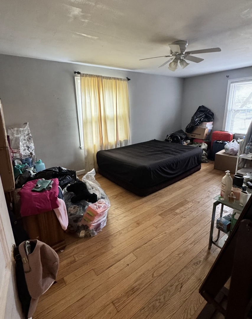 4012 Madison Avenue Brookfield, IL 60513 - Photo 2 of 2 a bedroom with a bed and window