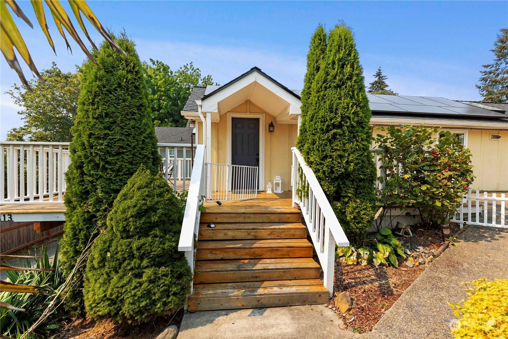 313 Earlington Avenue Southwest Renton, WA 98057 - Photo 30 of 35 a view of a house with a yard and plants
