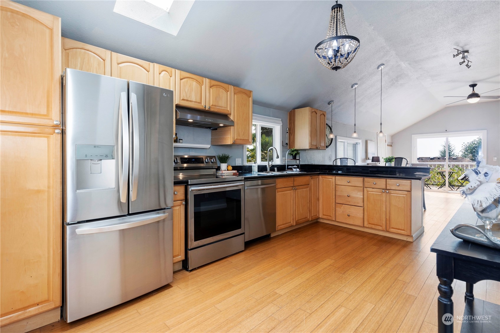 313 Earlington Avenue Southwest Renton, WA 98057 - Photo 4 of 35 a kitchen with stainless steel appliances granite countertop a refrigerator a sink dishwasher a stove and a refrigerator