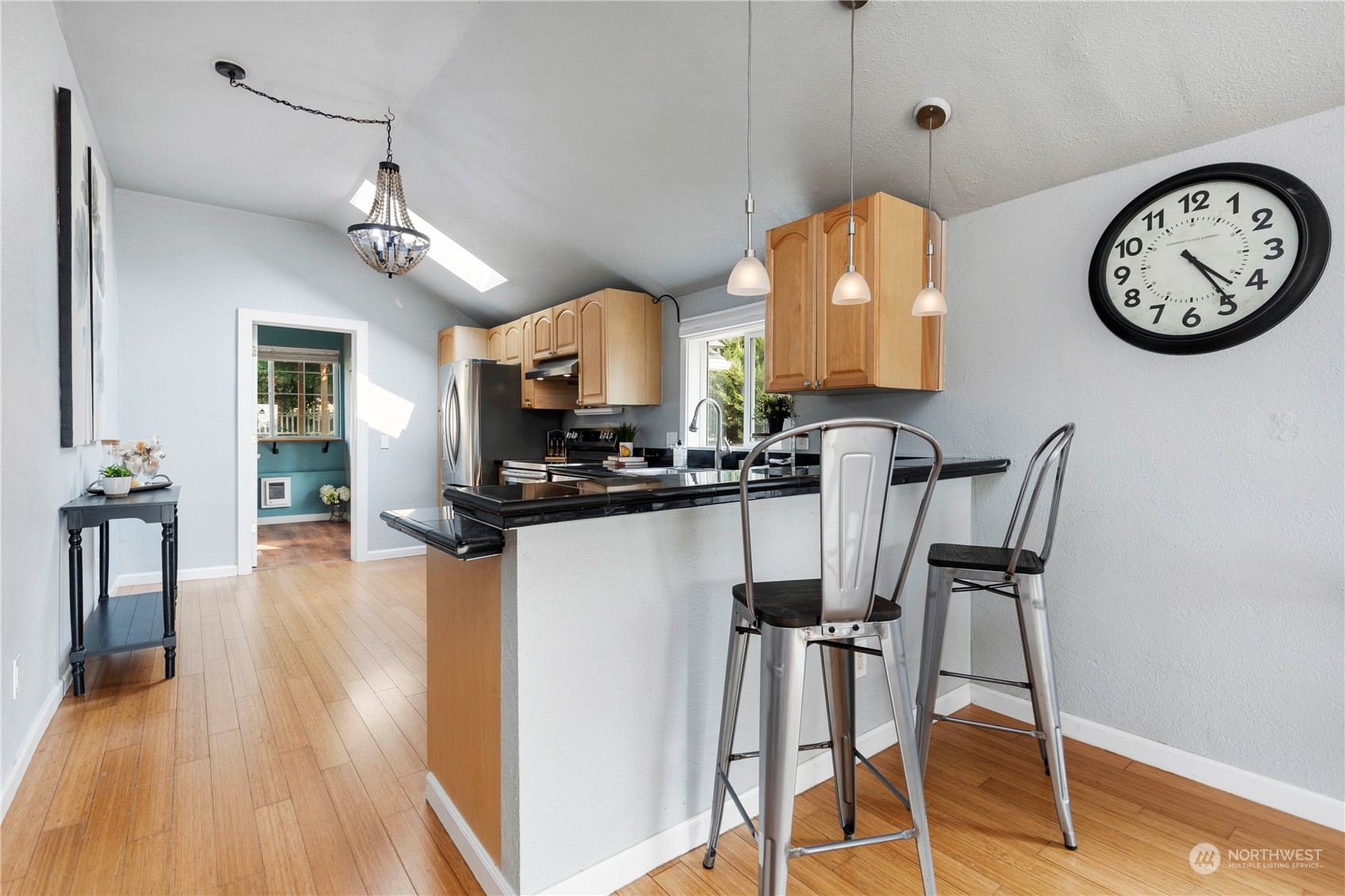 313 Earlington Avenue Southwest Renton, WA 98057 - Photo 9 of 35 a view of a kitchen with a table and chairs