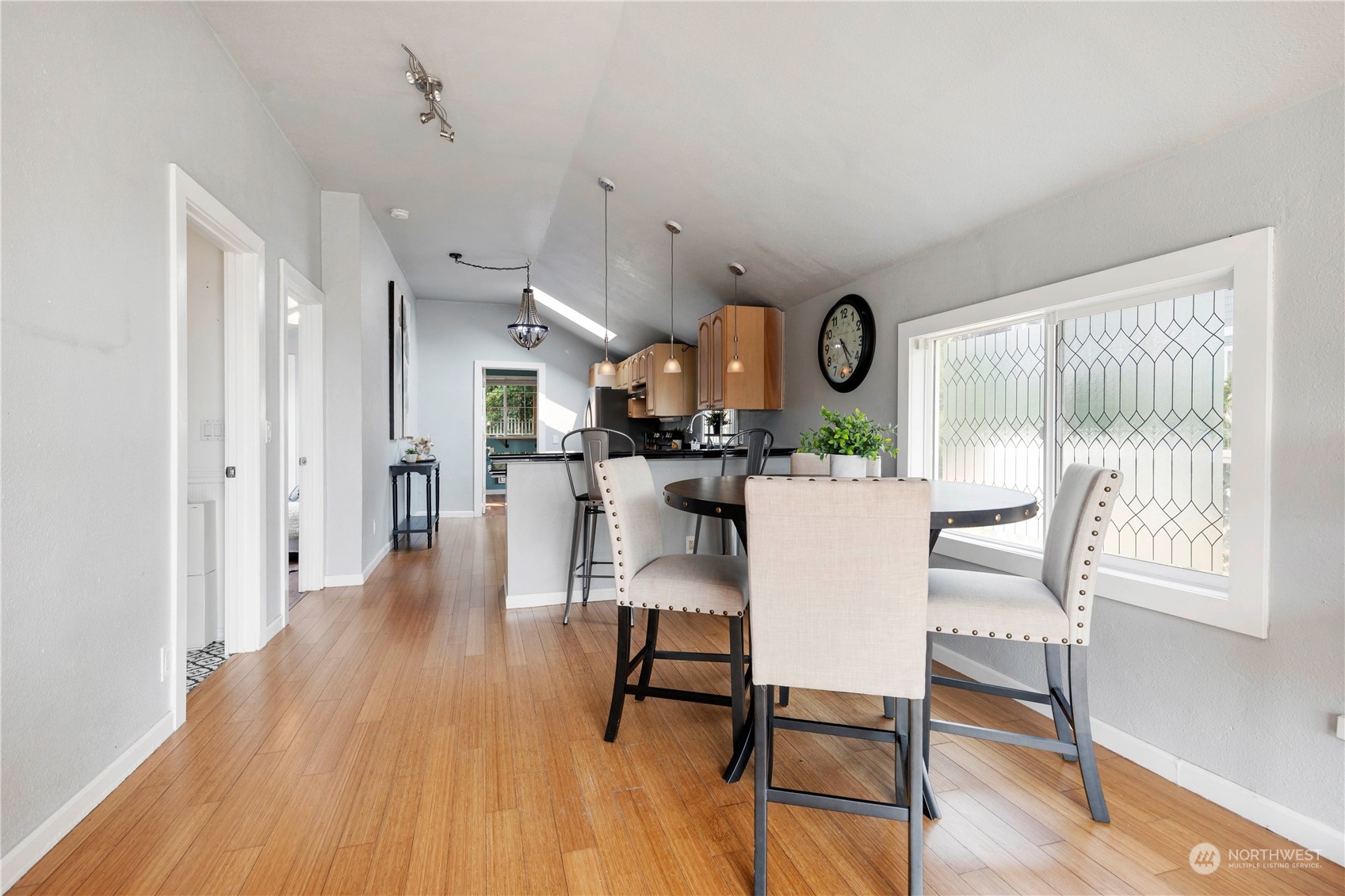 313 Earlington Avenue Southwest Renton, WA 98057 - Photo 10 of 35 a view of a dining room with furniture window and wooden floor