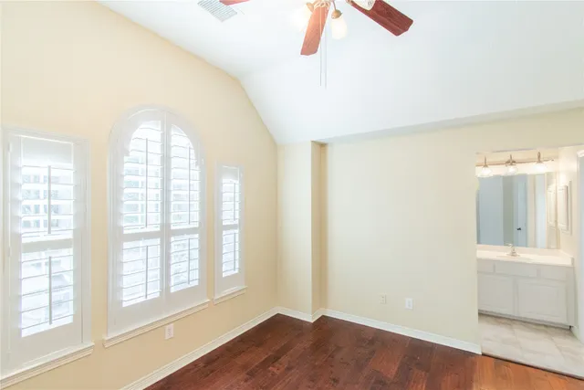 a view of an entryway with wooden floor