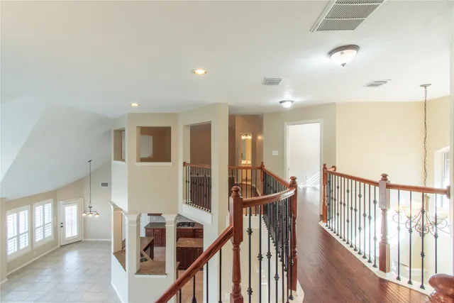 a view of an entryway with wooden floor