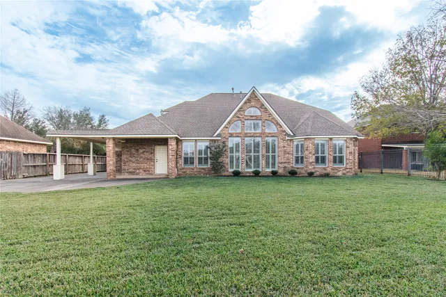 a view of a lake with houses in the back