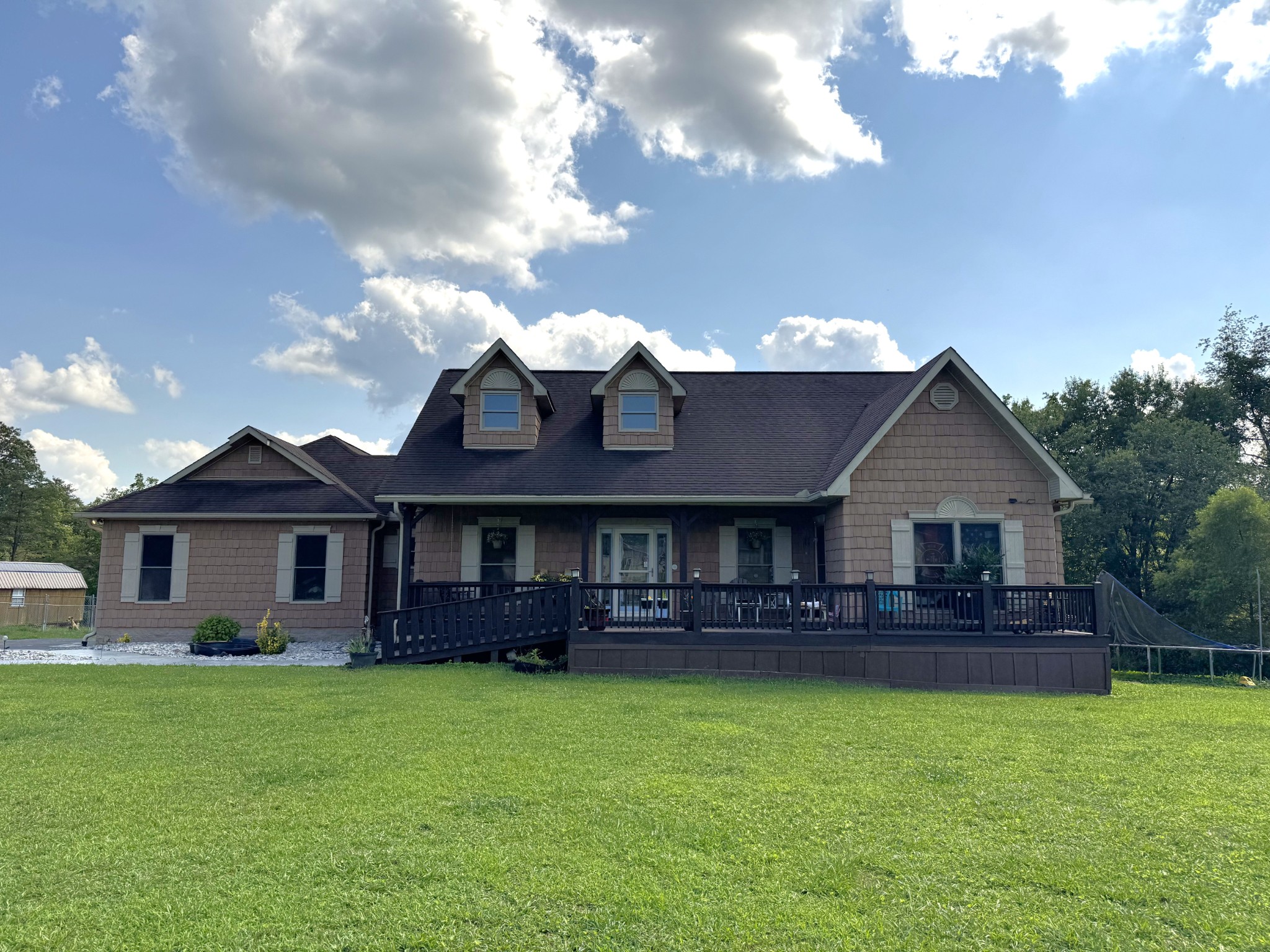 12466 Highway 108 Altamont, TN 37301 - Photo 1 of 40 a front view of a house with a garden and yard