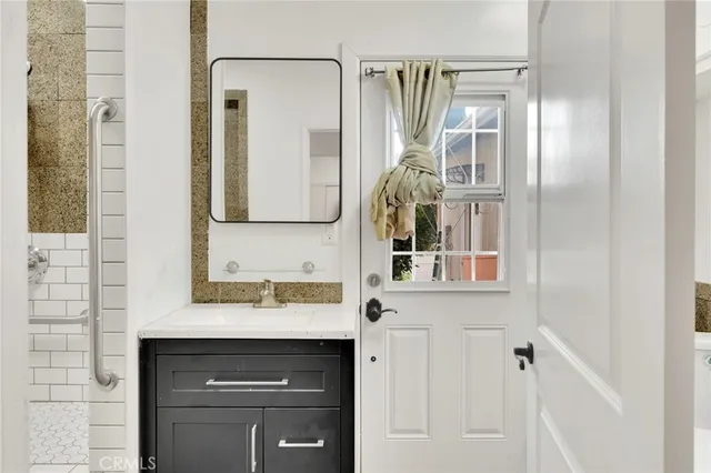 a bathroom with a sink and a mirror