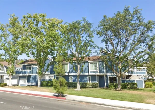 front view of a building with a tree
