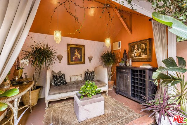 a backyard with a table and chairs