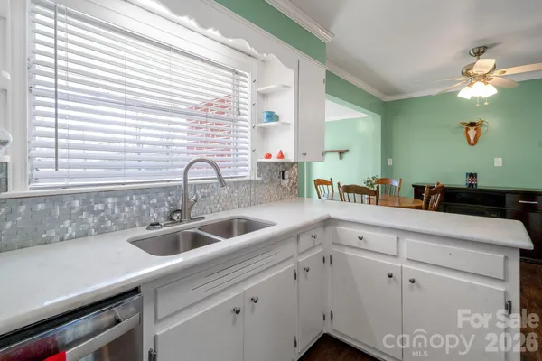 a kitchen with a sink and cabinets