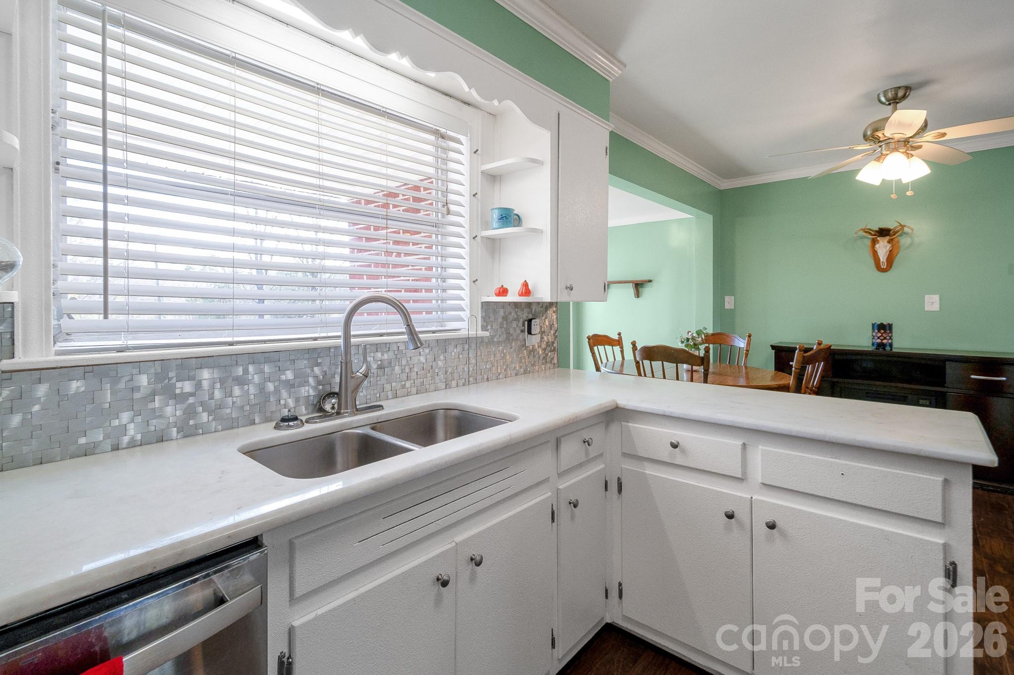 1099 South Potter Road Lancaster, SC 29720 - Photo 12 of 41 a kitchen with a sink and cabinets