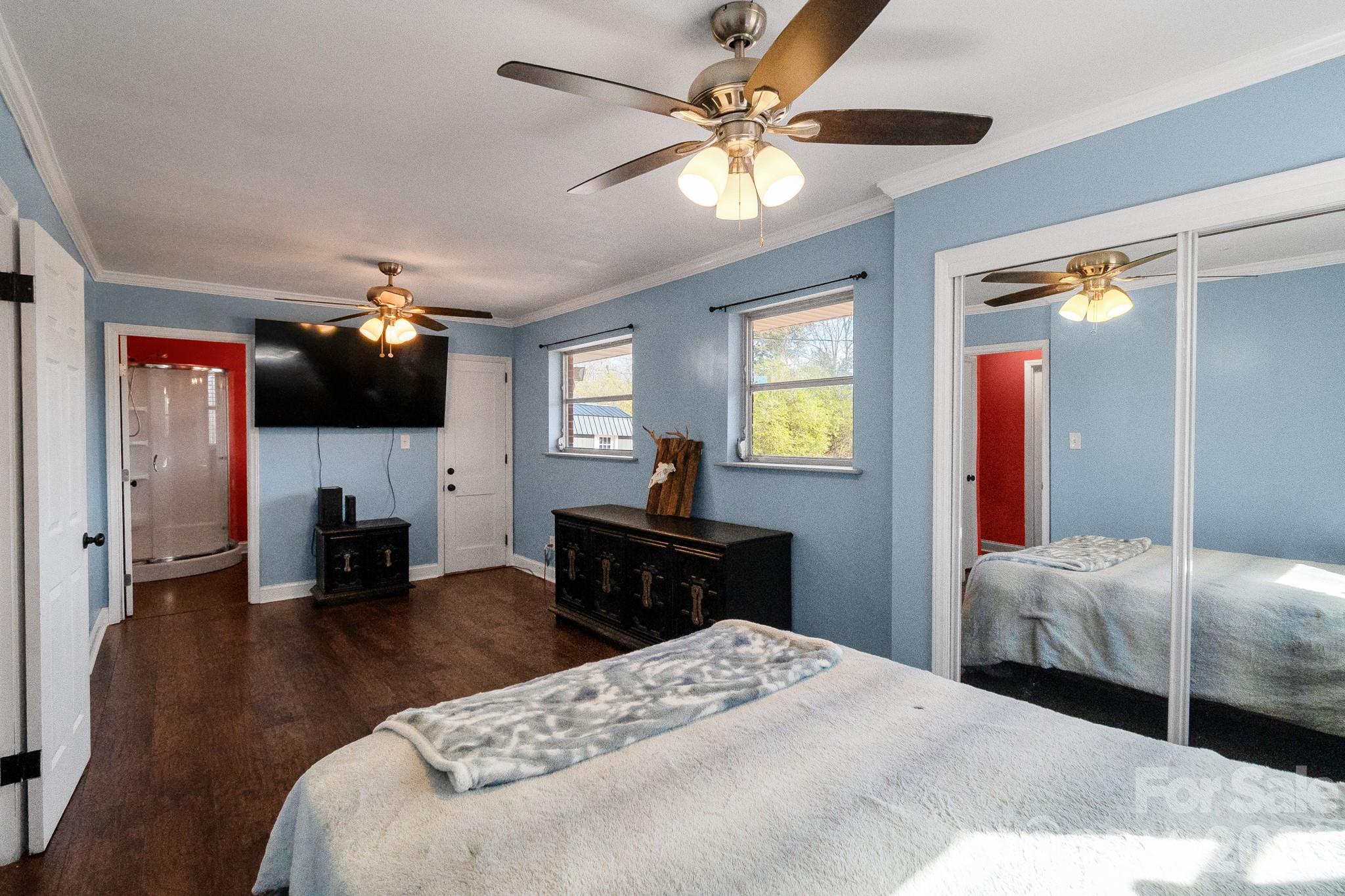 1099 South Potter Road Lancaster, SC 29720 - Photo 20 of 41 a bedroom with a bed and a flat screen tv