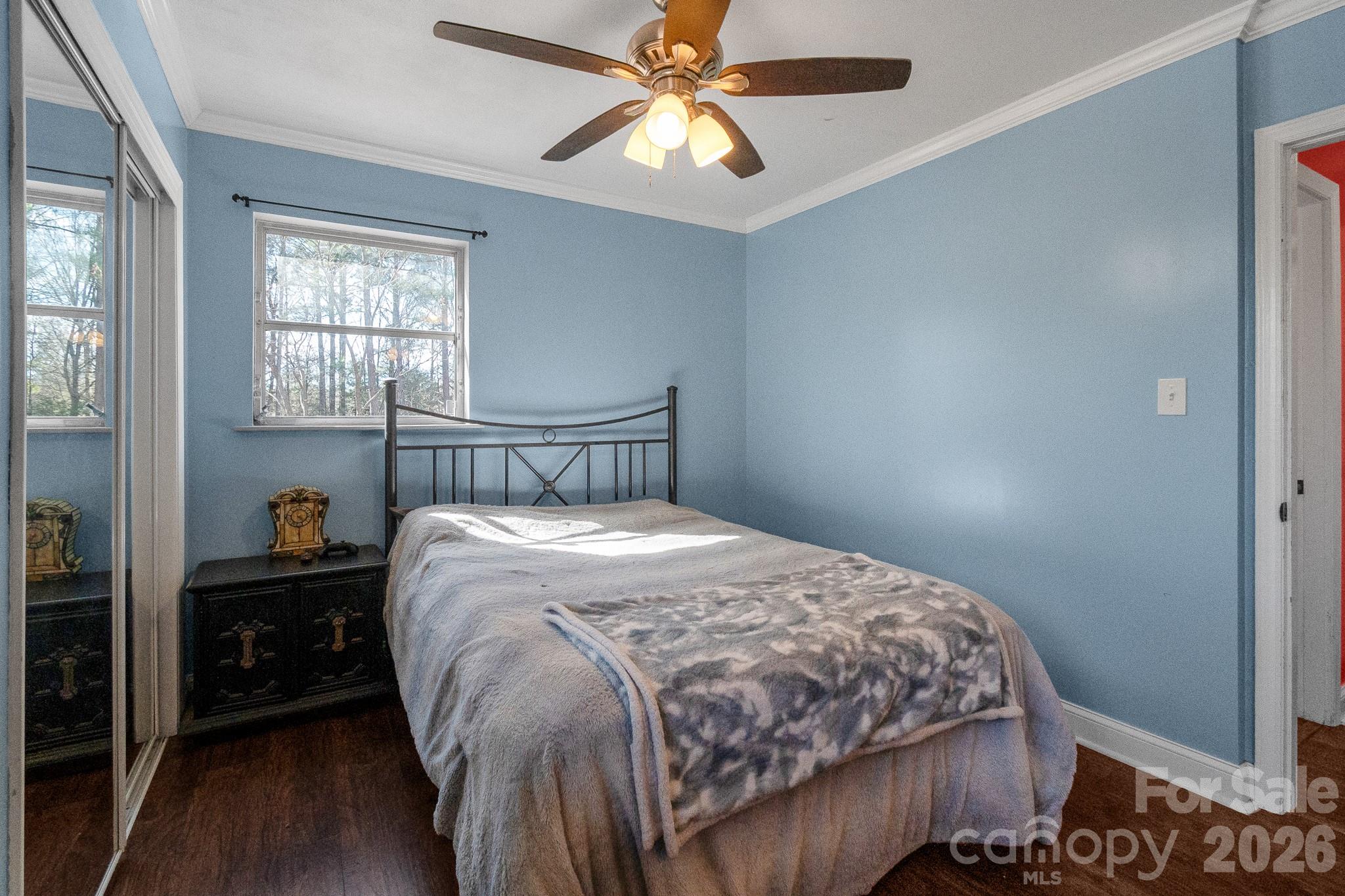 1099 South Potter Road Lancaster, SC 29720 - Photo 22 of 41 a bedroom with a bed and a chandelier