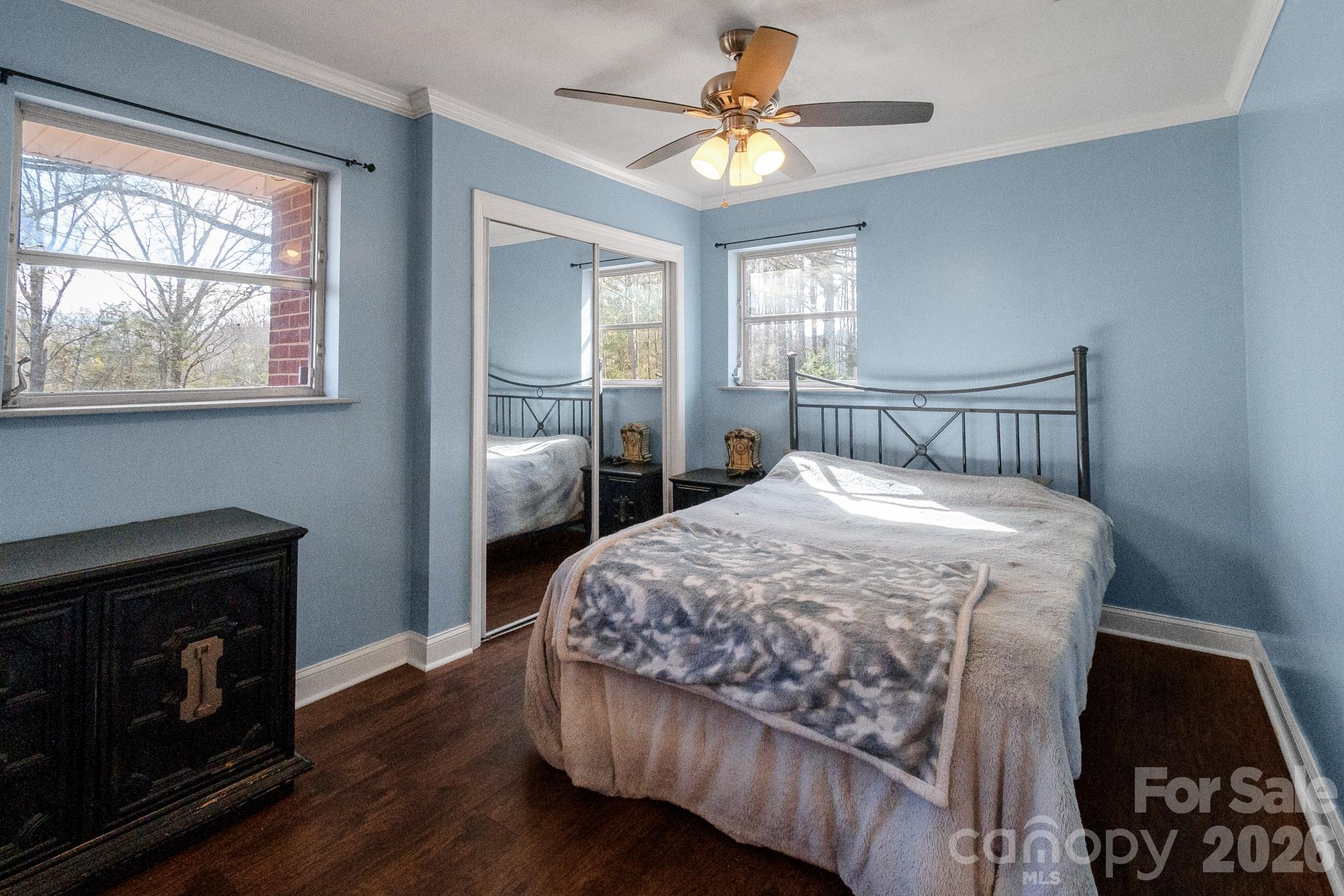 1099 South Potter Road Lancaster, SC 29720 - Photo 23 of 41 a bedroom with a bed and wooden floor
