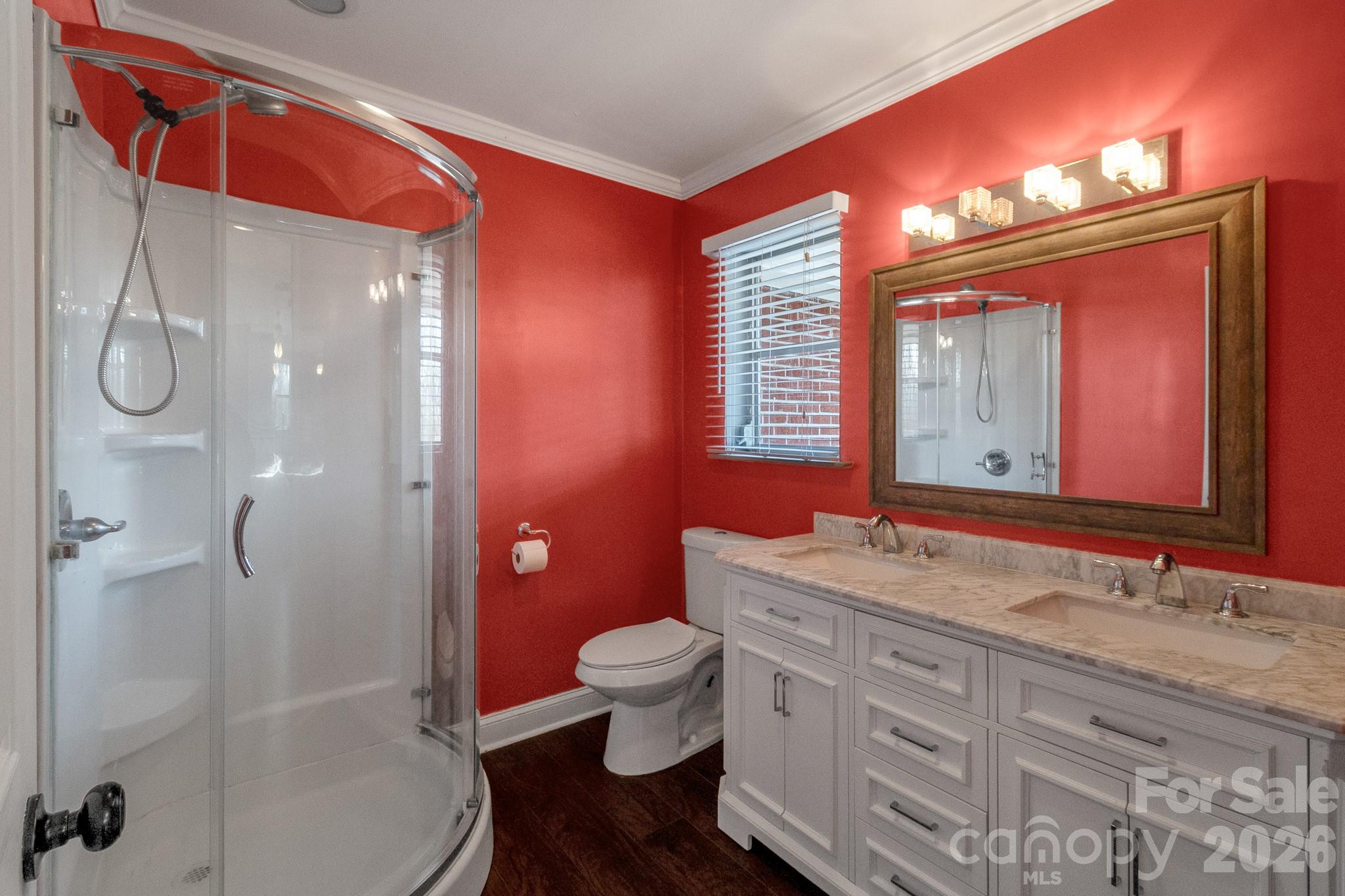 1099 South Potter Road Lancaster, SC 29720 - Photo 24 of 41 a bathroom with a granite countertop sink toilet a large mirror and shower
