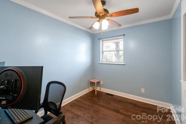 a view of workspace with window and ceiling fan