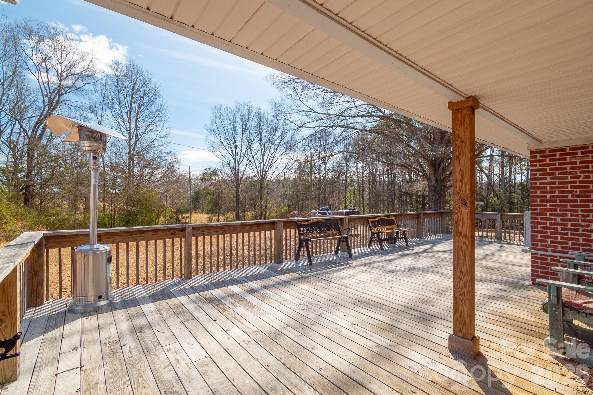 1099 South Potter Road Lancaster, SC 29720 - Photo 37 of 41 a view of a deck with wooden floor and fence with a bench