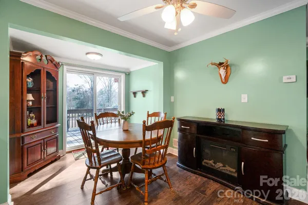 a dining room with furniture and window