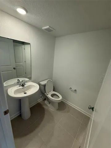 a bathroom with a glass door