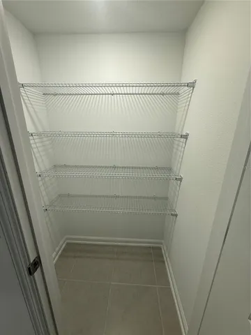 a view of staircase with white walls