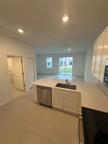 a kitchen with a stove and a sink