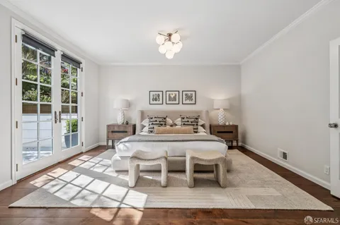 a spacious bedroom with a large bed and a window