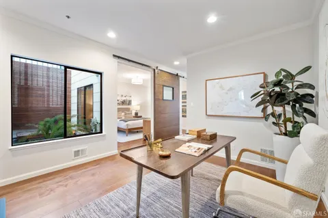 a living room with furniture and a window